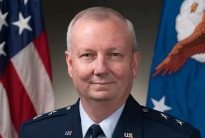 Headshot of Major General Randal Fullhart in full military attire with the U.S. flag and U.S. Air Force flag behind him.